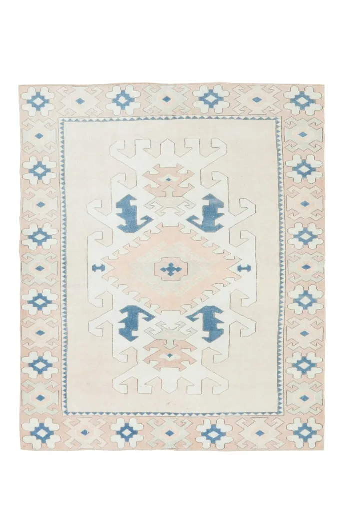 Full overhead shot of the vintage Anatolian rug, showcasing its complete design and colors.