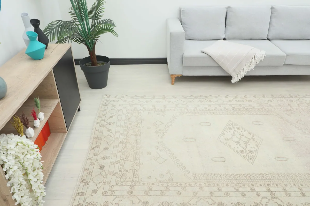 Angle view of the rug in a room, showing its placement relative to a modern console and sofa.