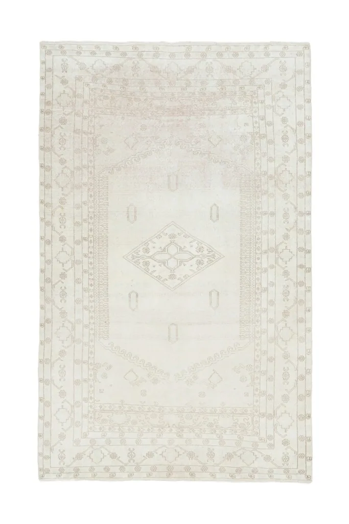 Full overhead view of the 5x9 vintage Anatolian rug on a white background, showcasing its overall design.