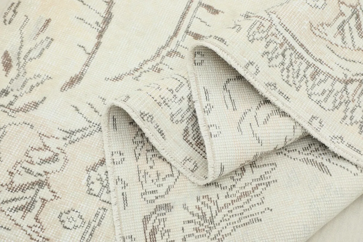 Multiple folds of the rug showcasing the flexibility and hand-knotted construction