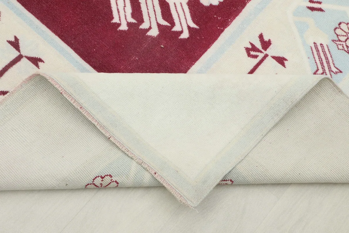 View of the rug's backside, showing the hand-knotted cotton foundation