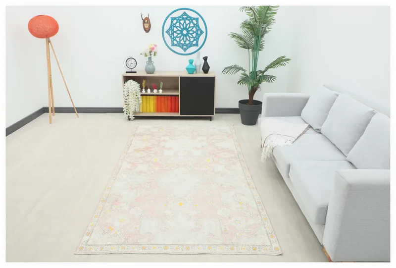 Full top view of the 5x9 vintage rose and ivory Anatolian area rug.