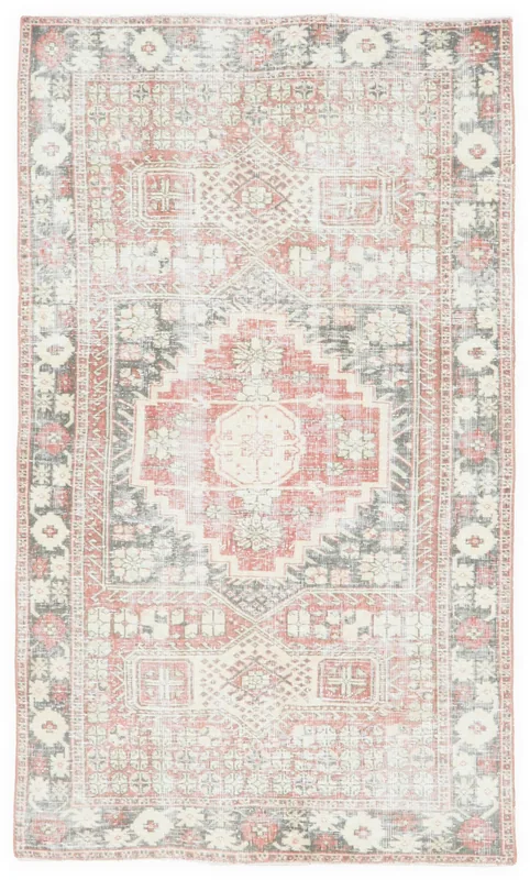 Full overhead view of the vintage red, gray, and ivory Anatolian rug on a white background