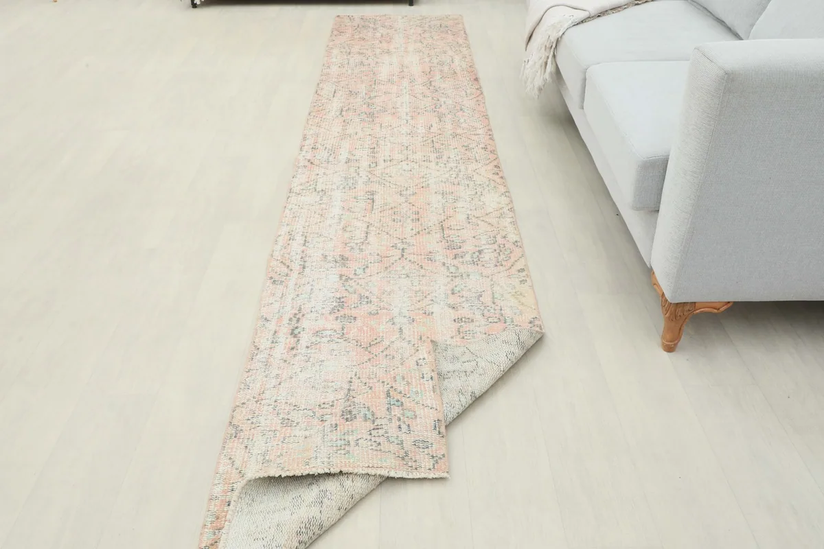 Runner rug partially folded, showcasing its flexibility and full length