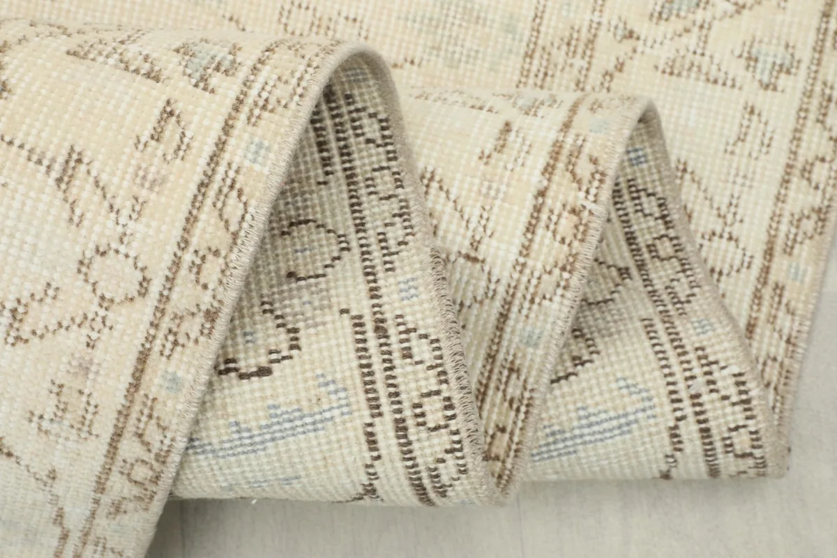 Close-up of the low wool pile and hand-knotted texture of the vintage Anatolian area rug