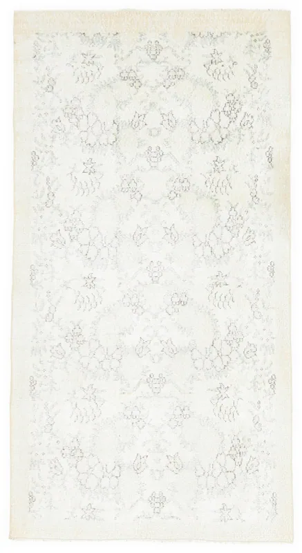 Full top view of the ivory and gray floral geometric vintage Anatolian rug.