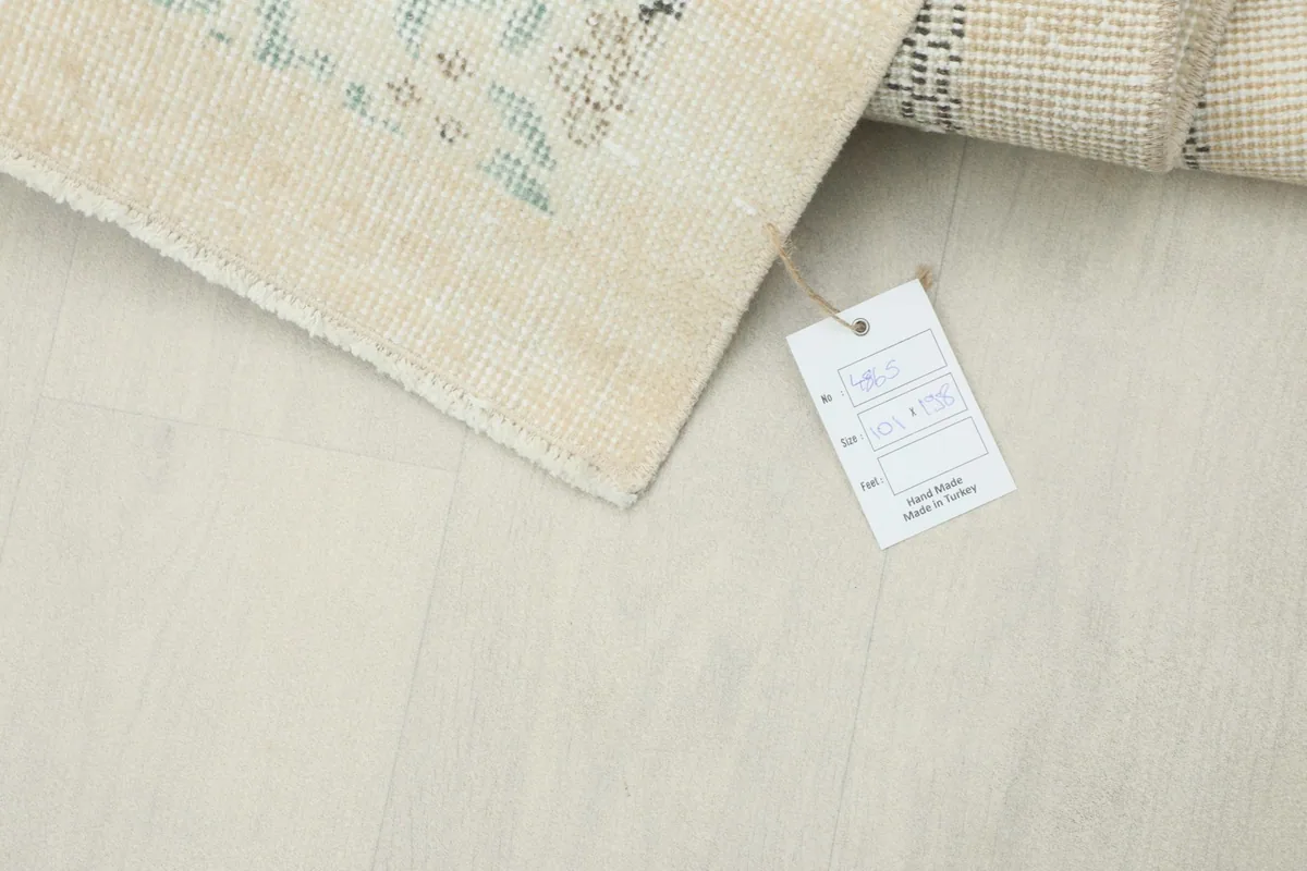 Corner of the rug with a product tag, indicating its origin and material.
