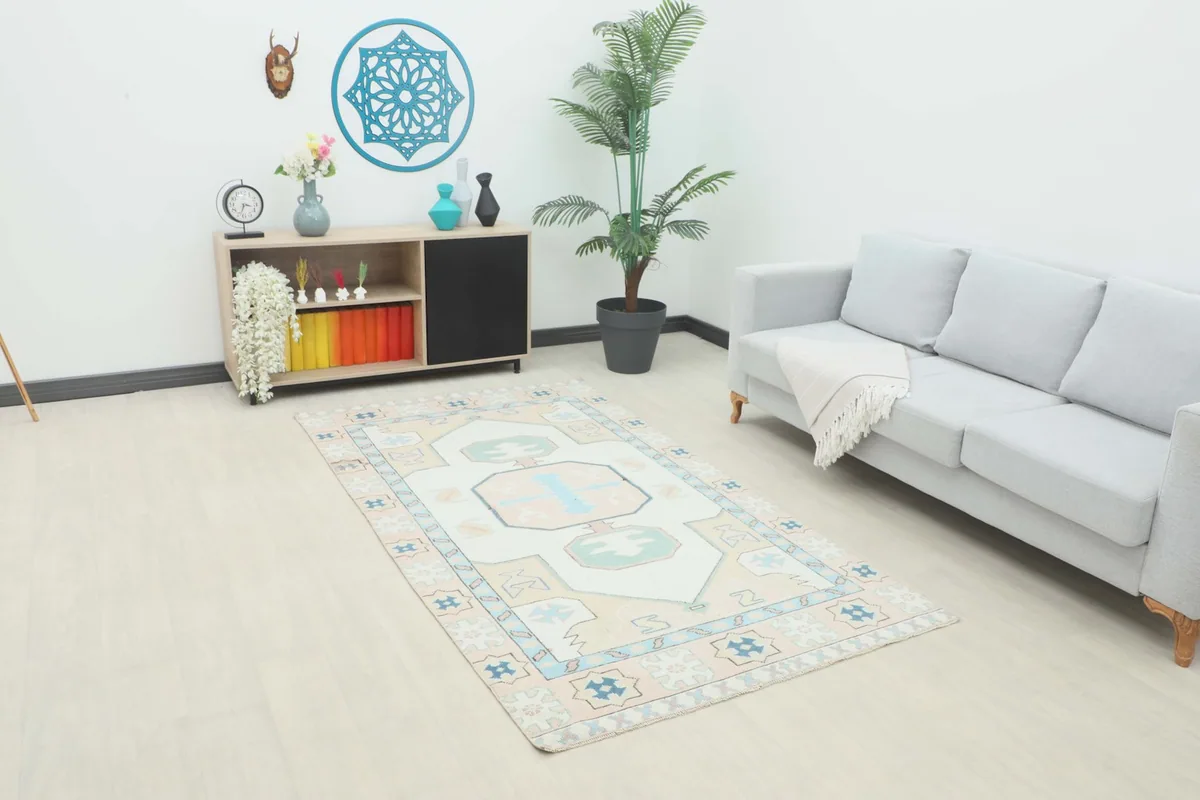 Angled view of the rug in a living room setting with a sofa and console table
