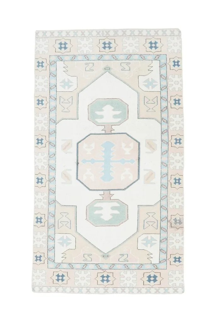 Full overhead view of the vintage Anatolian rug, displaying the complete geometric design