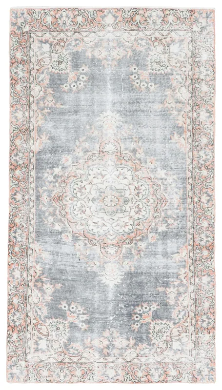 Full top view of the vintage gray and orange medallion rug