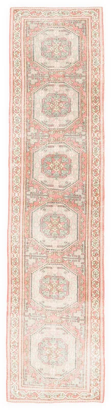 Full overhead view of the rust and gray vintage Anatolian runner rug on a white background