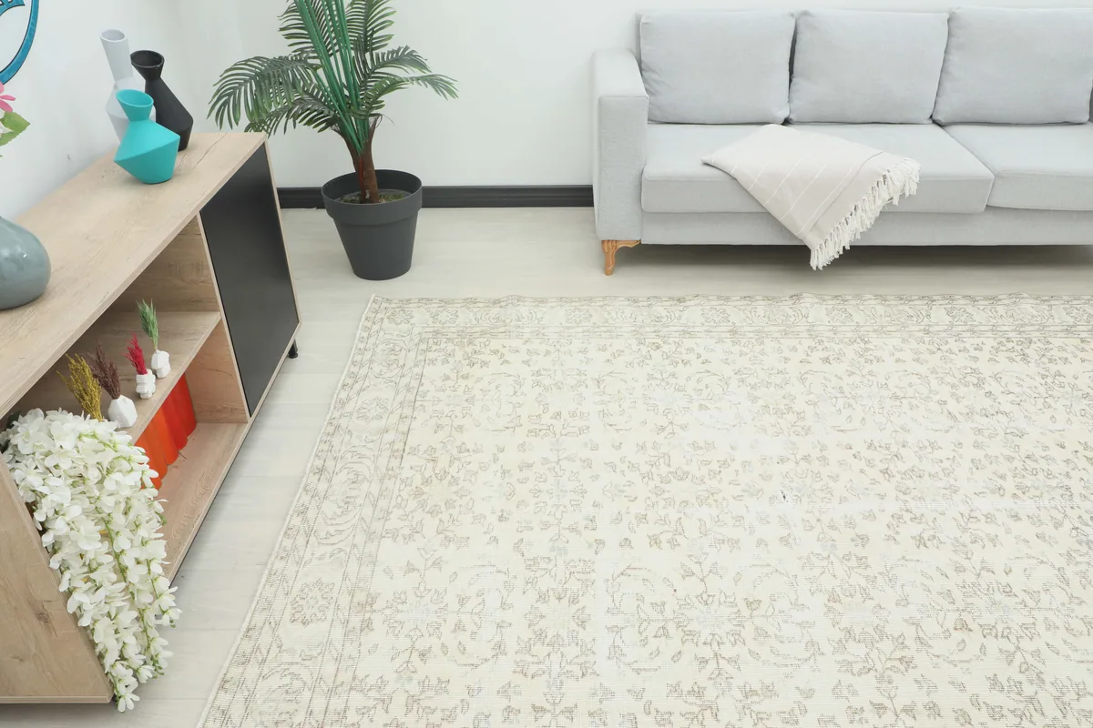 Cream Floral Anatolian Rug placed in a spacious room, providing a soft foundation for modern furniture