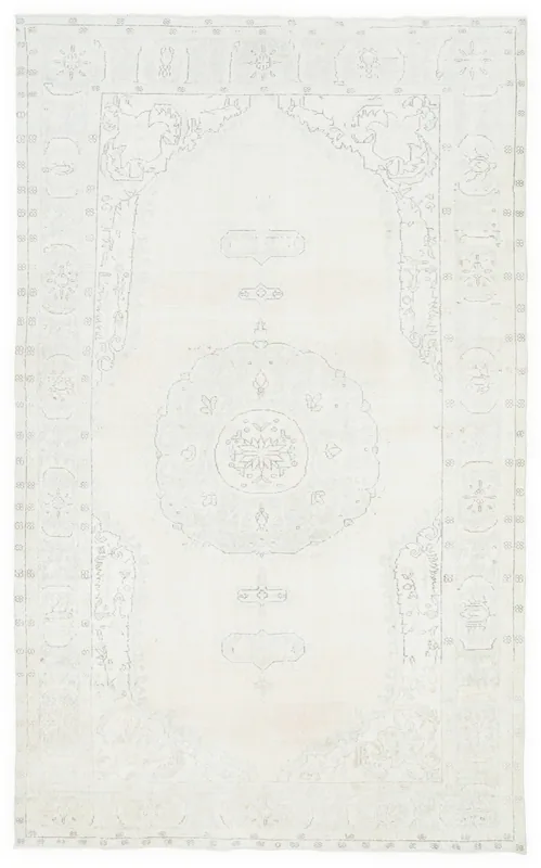 Full overhead view of the 6x10 ivory Anatolian vintage rug with central medallion and geometric border