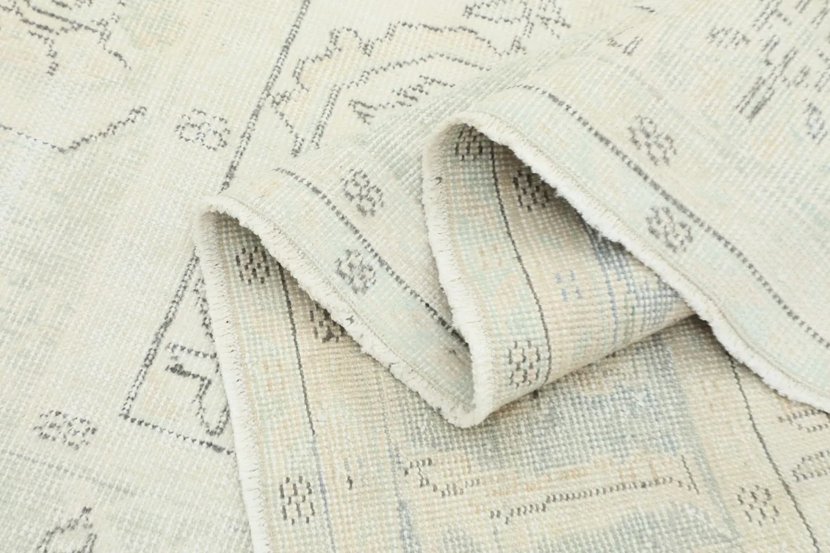 Folded section of the rug showing the thickness of the material and the back of the weave
