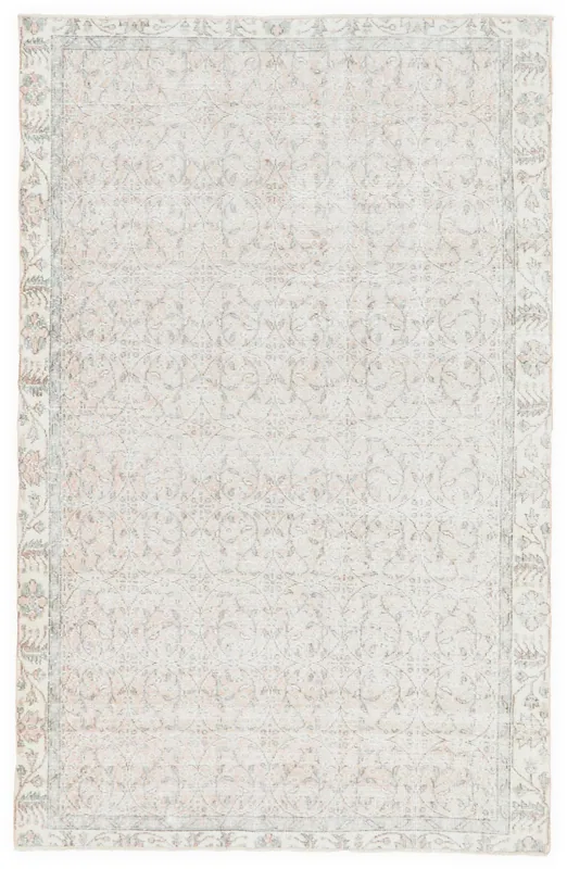 Full overhead view of the 5x8 ivory and rose vintage Anatolian rug on a white background
