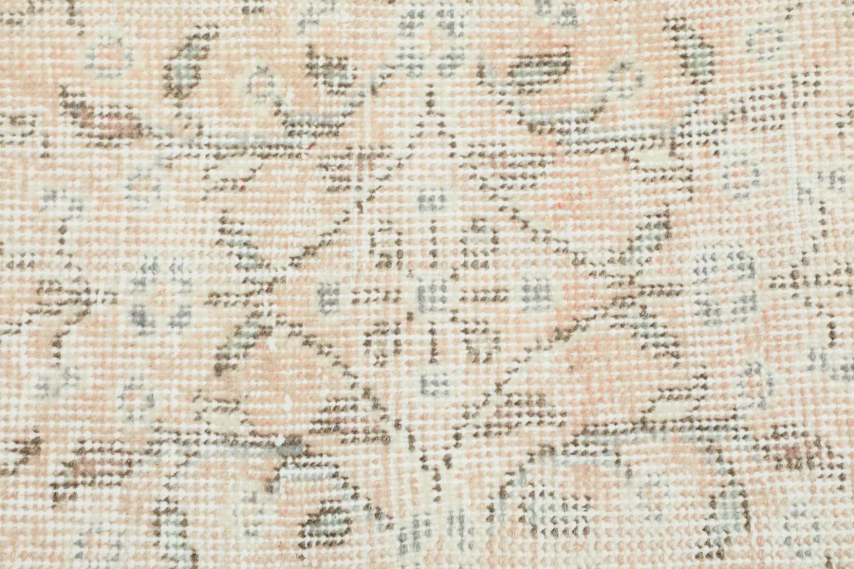 Close-up showcasing the intricate hand-knotted wool pile and subtle color variations