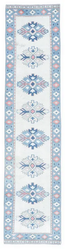 Full top view of the 2'3" x 9'9" ivory, blue, and rose geometric Anatolian runner rug