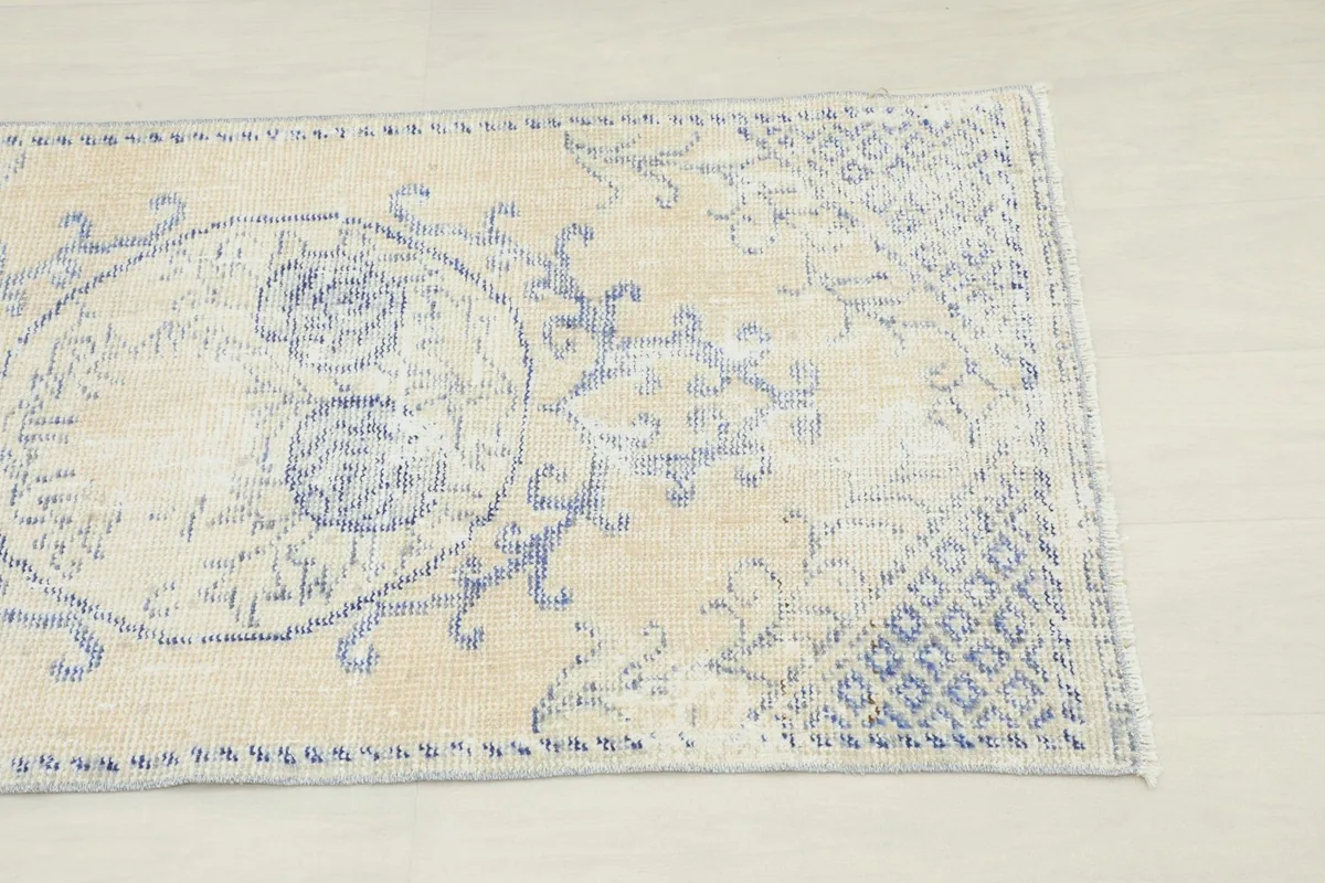 Close-up view of the upper right section of the rug, highlighting the geometric border