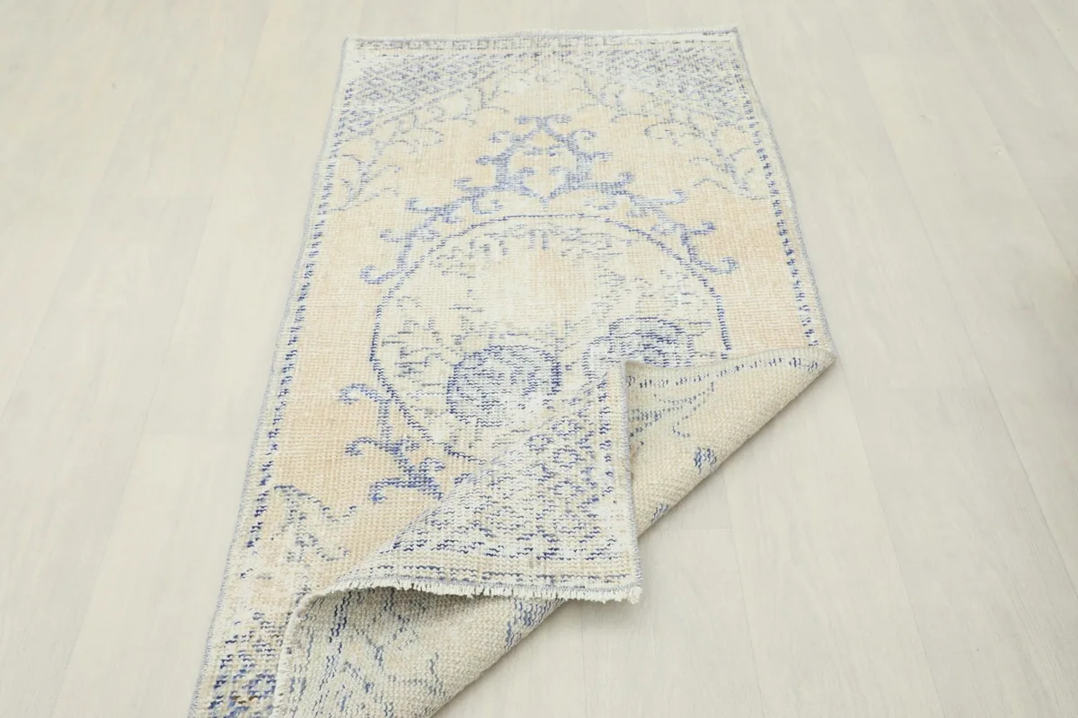 The rug folded to show its flexibility and the consistent pattern from another angle