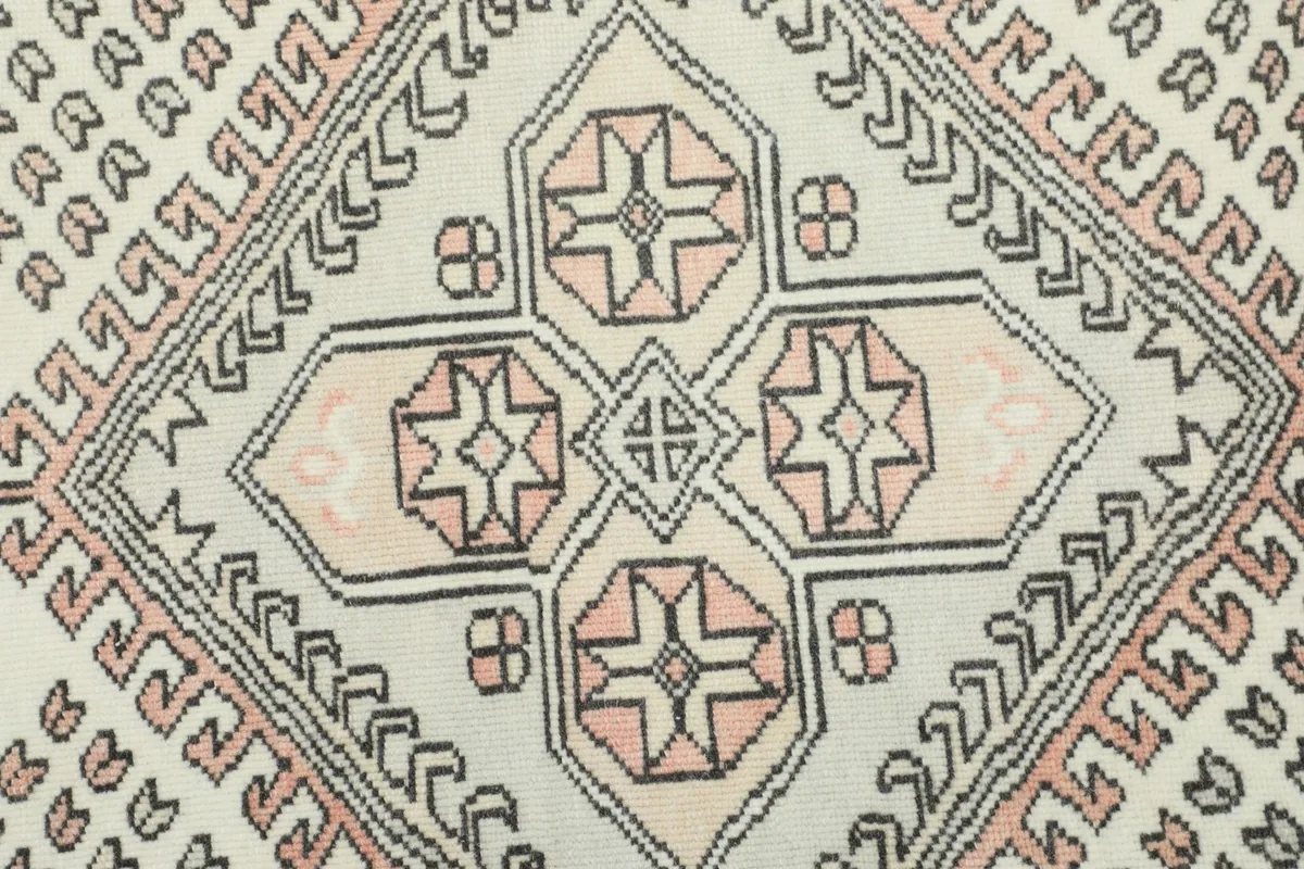 Detailed view of the central medallion's intricate geometric design and colors