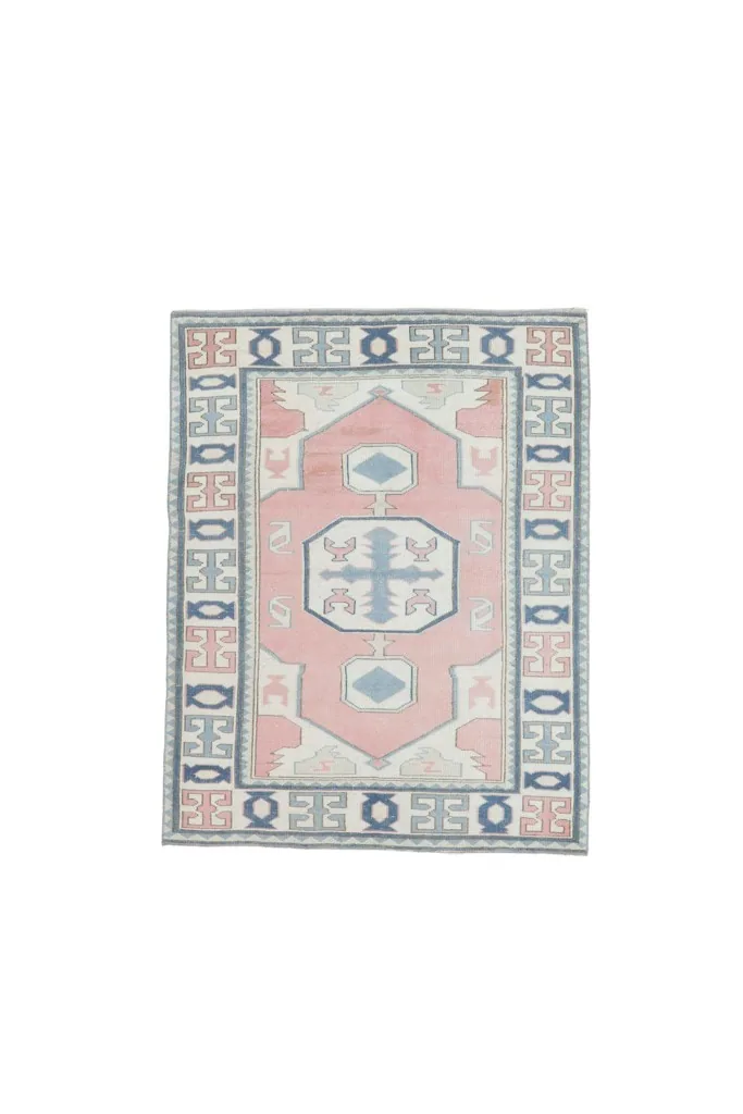 Full overhead view of the 4x5 pink, blue, and ivory vintage Anatolian area rug