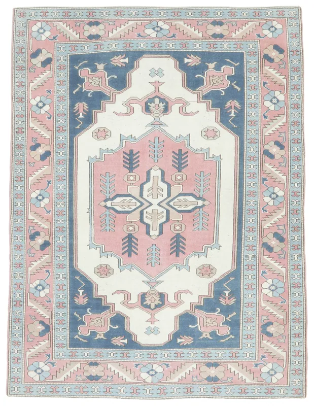 Full overhead view of the 6'11" x 9'0" vintage Anatolian rug with rose, navy, and ivory colors