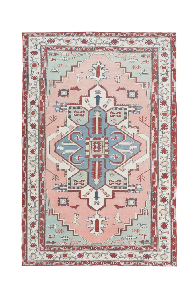 Overhead shot of the entire vintage Anatolian rug on a white background, displaying its full design.