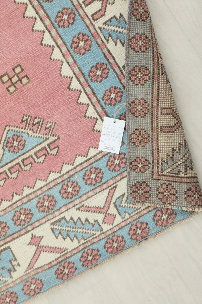 Underside of the vintage Anatolian rug, displaying the cotton foundation and fine hand-knotting