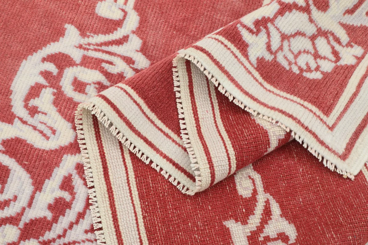 Folded section of the rug highlighting the low pile and intricate patterns