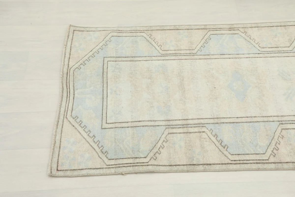 Close-up of the other end of the rug, showing slight wear and color variations