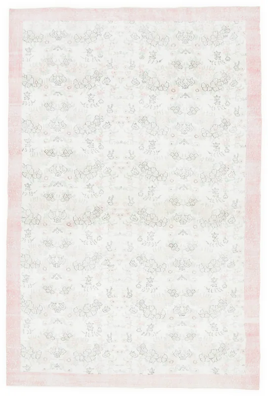 Top view of the 6'9" x 10'3" vintage Anatolian rug with a cream field and pink border