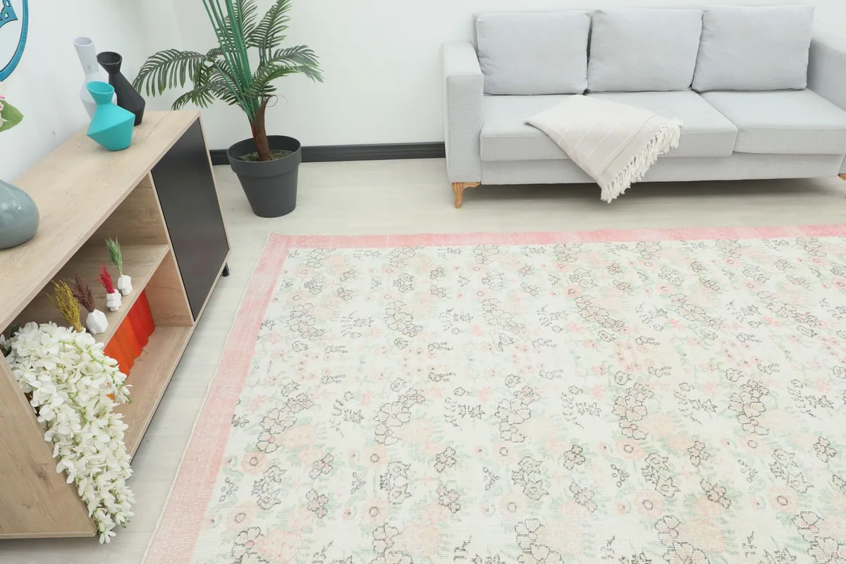 Angle view of the large rug in a room, highlighting its placement next to a console table