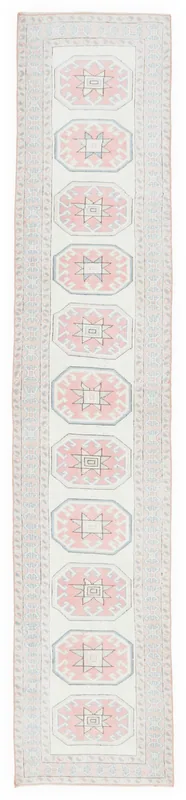 Full overhead view of the Rose Ivory Geometric Anatolian runner on a white background.