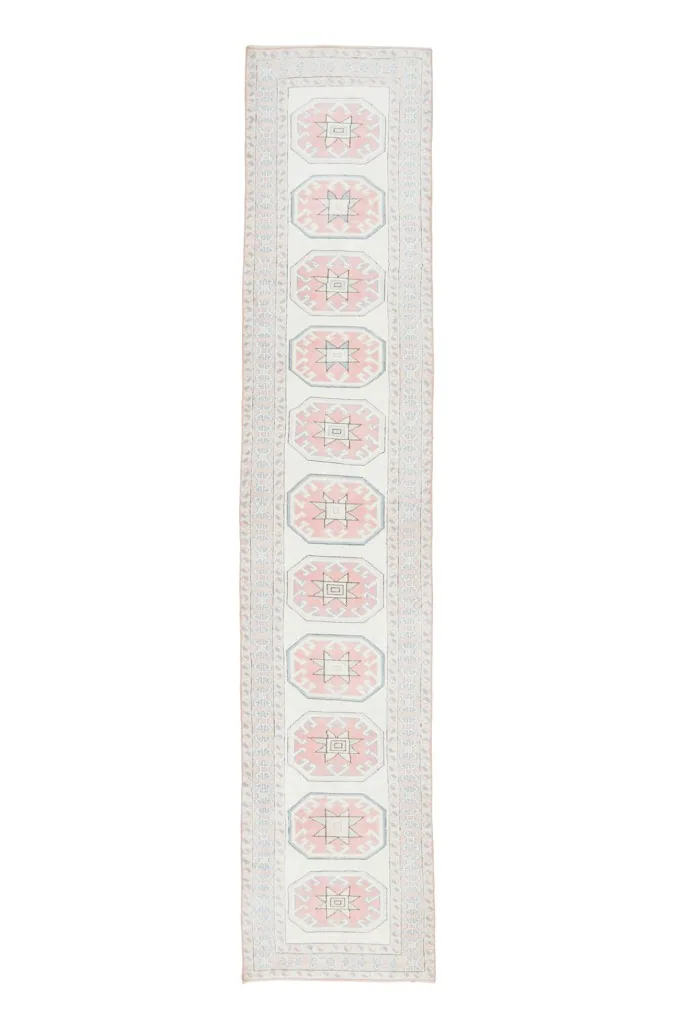 Full overhead view of the Rose Ivory Geometric Anatolian runner, showcasing its entire length.