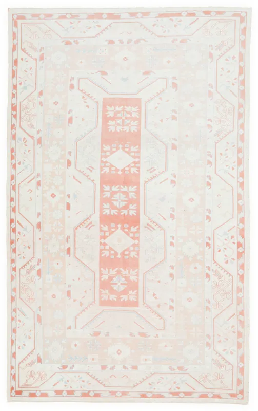 Full overhead view of the 7'7" x 12'2" vintage cream and rose geometric Anatolian area rug