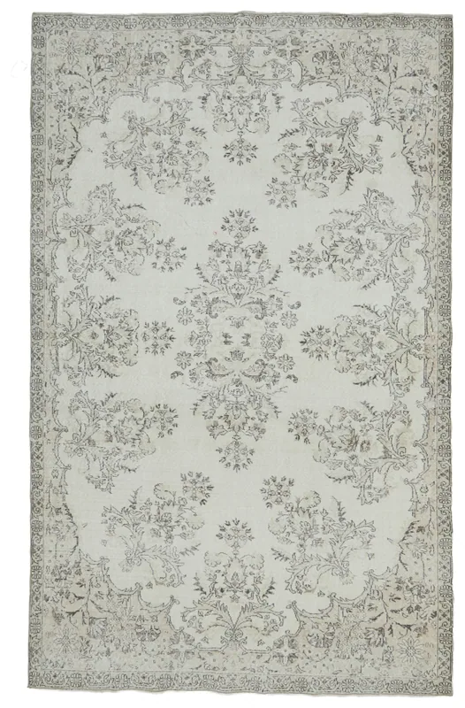 Overhead view of the Cream Gray Floral Medallion Rug on a white background