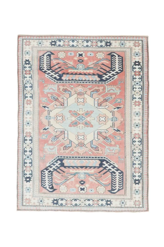 Full overhead shot of the 5'9" x 7'8" vintage area rug on a white background, capturing its complete design.