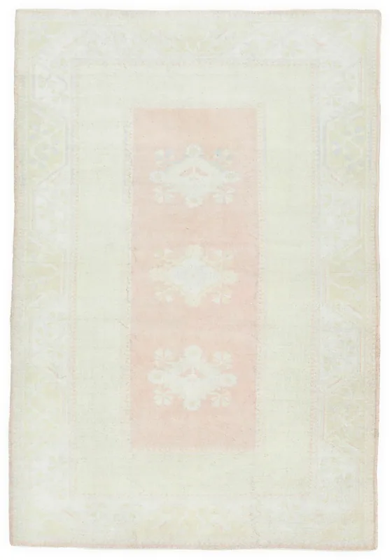 Full overhead view of the vintage Anatolian rug with rose central panel and beige field