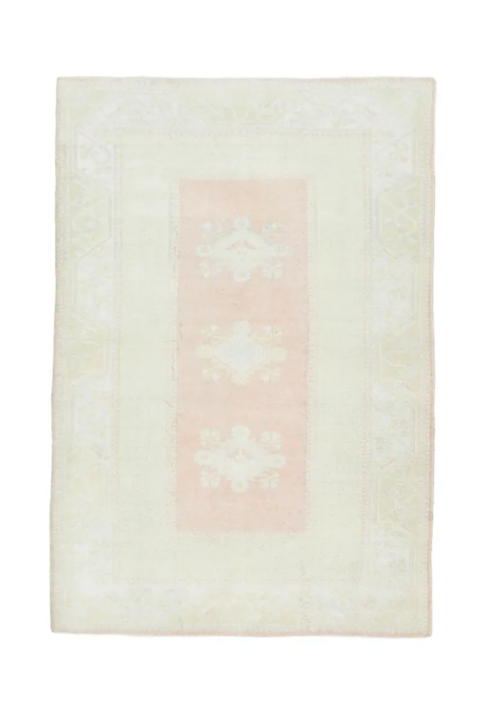 Full overhead view of the vintage Anatolian rug, isolated on a white background
