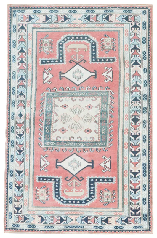 Full overhead view of the 5'9" x 9'0" rose, navy, and beige vintage Anatolian rug.
