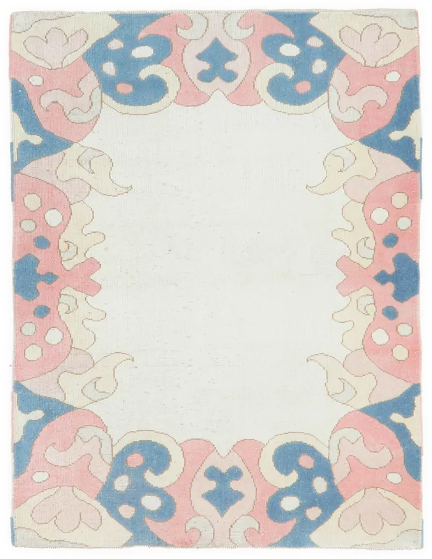 Full overhead view of the 4x6 ivory, rose, and blue vintage Anatolian rug on a white background.
