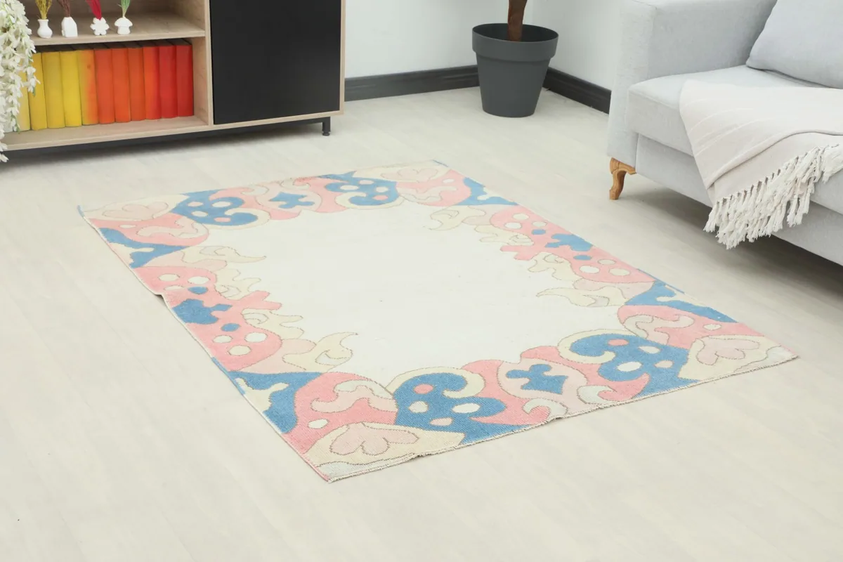 Angle view of the rug in a living room, highlighting its position relative to furniture.