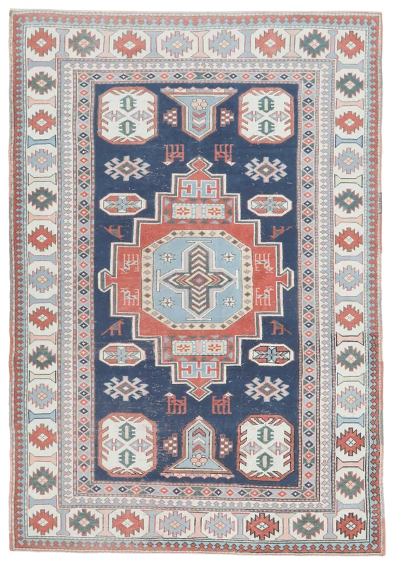 Full overhead view of the navy, red, and ivory geometric Anatolian rug