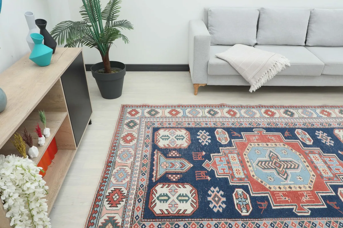 Angle view of the rug complementing a neutral-toned sofa and wooden console