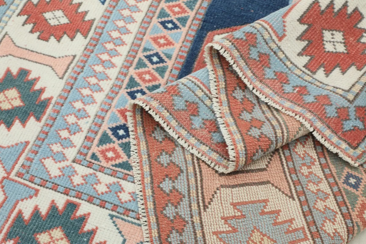 Another folded view showing the various colors and hand-knotted construction