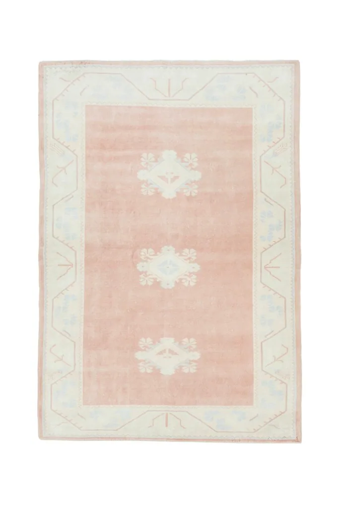 Full overhead view of the rug on a white background, capturing its rectangular shape and design