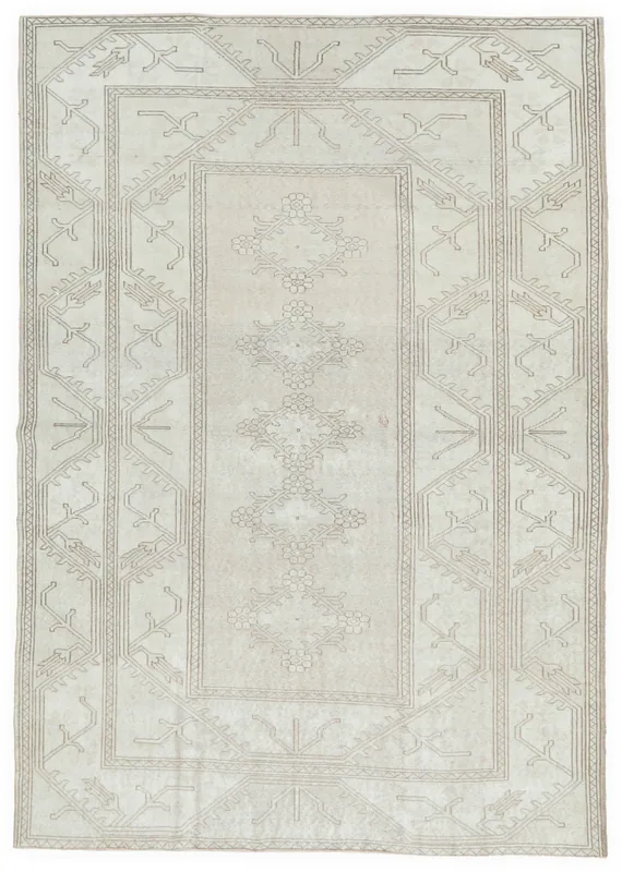 Full overhead view of the cream and brown vintage Anatolian area rug