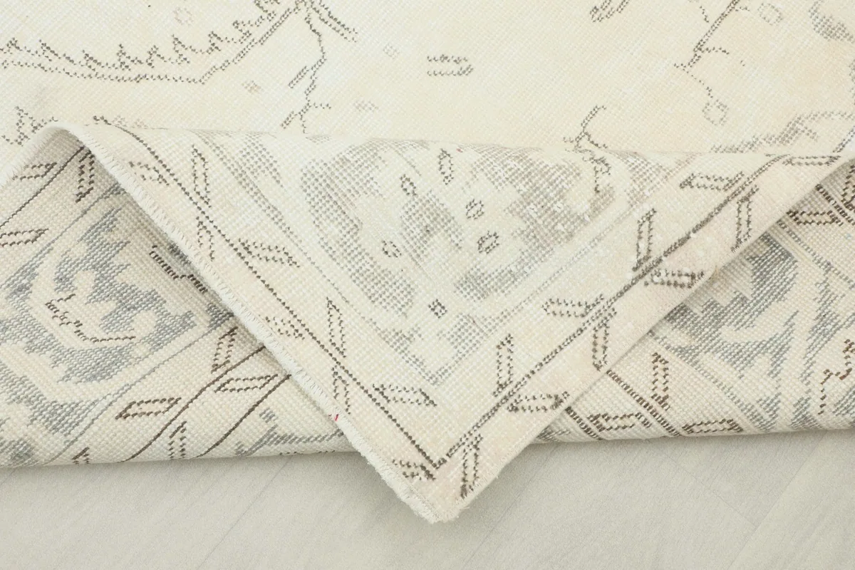 Underside of the rug showing the hand-knotted cotton foundation