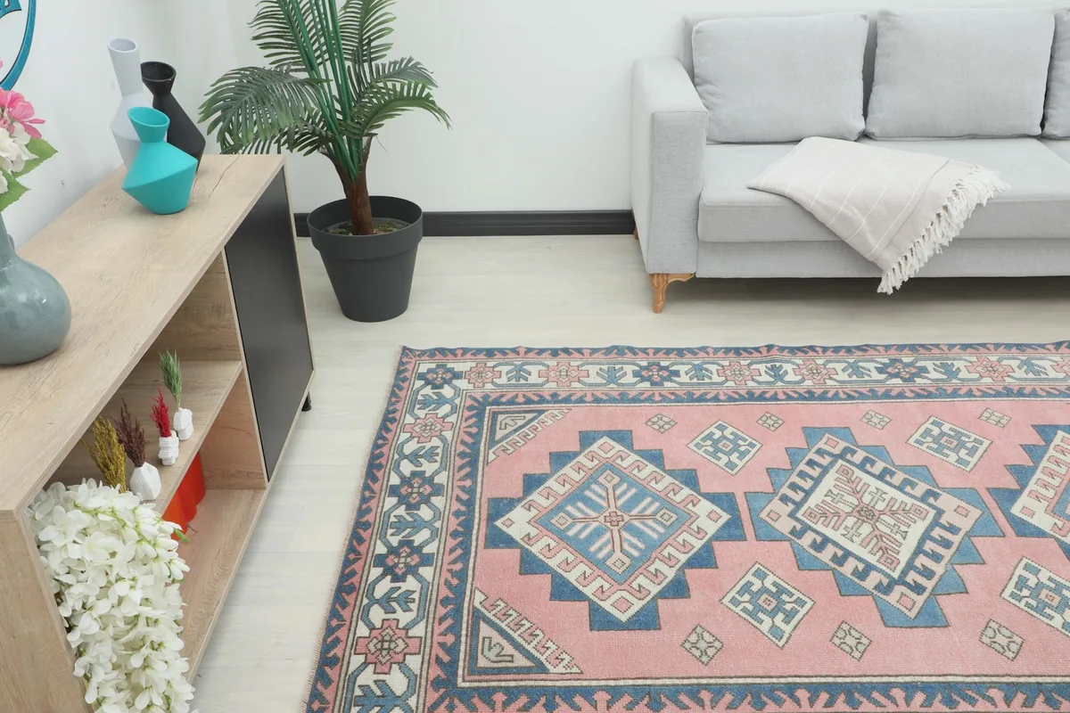 Angled view of the rug in a living space, showing its placement relative to furniture