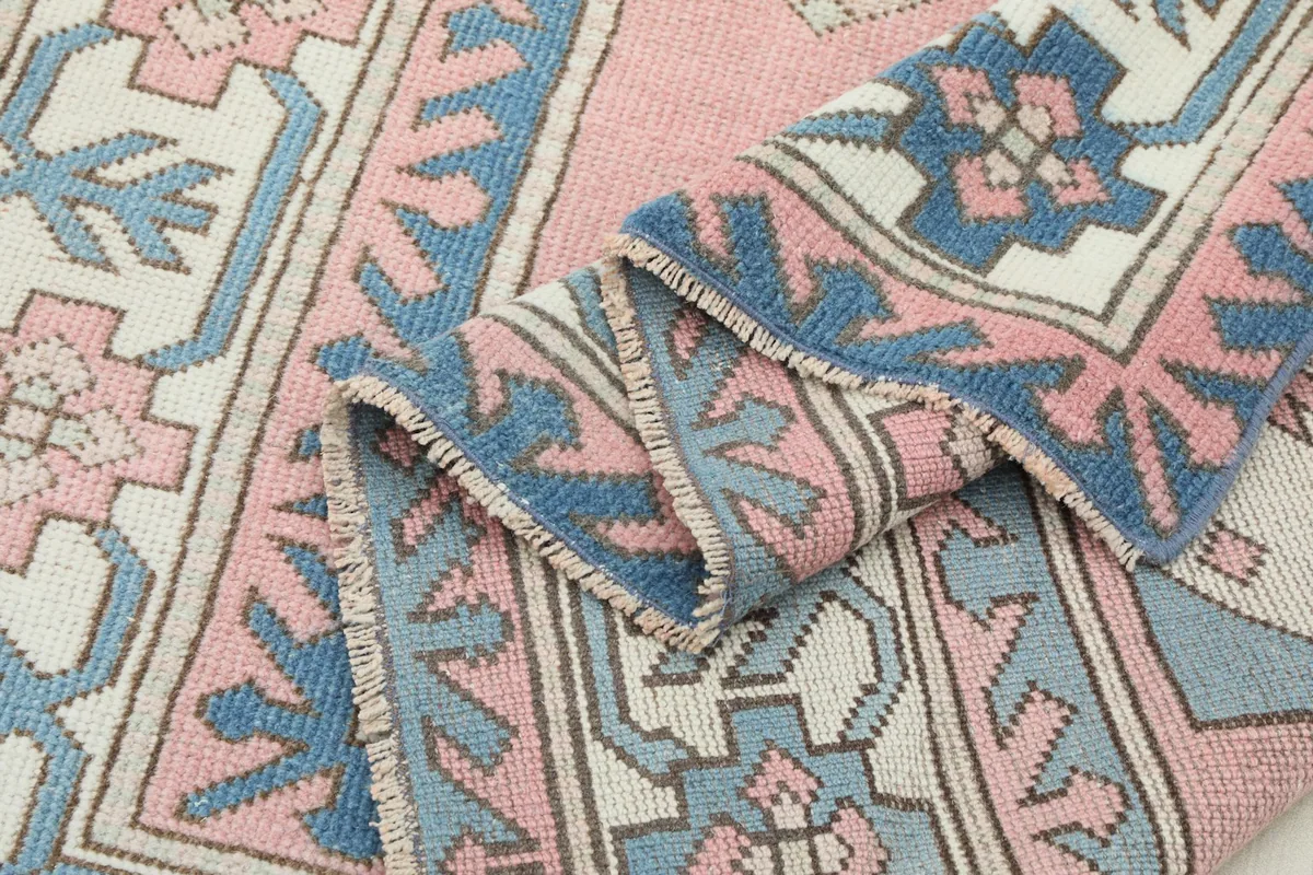 Side view of the rug pile, revealing the texture and slight variations in the wool